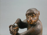 A Japanese Carved and Painted Monkey