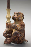 A Patinated Bronze Monkey Candleholder
